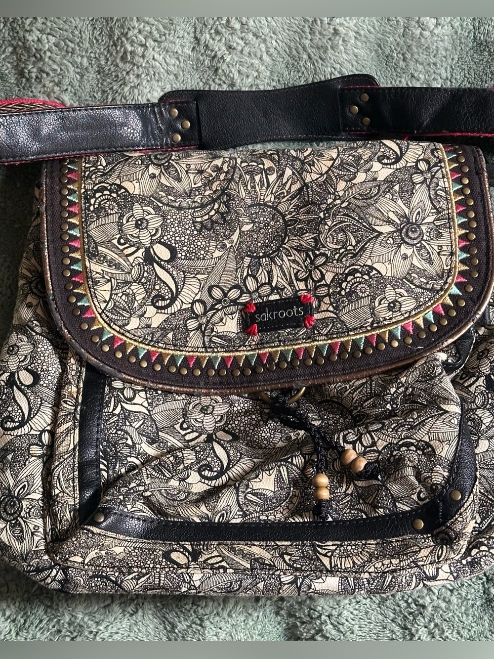 Sakroots Black and Cream Floral Canvas convertible backpack with Colorful Trim